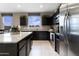 Modern kitchen featuring granite countertops, stainless steel appliances, and ample storage at 5106 E Midnight Star Dr, San Tan Valley, AZ 85143