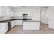 Bright kitchen features stainless steel appliances, granite counters, and white cabinetry at 5106 E Midnight Star Dr, San Tan Valley, AZ 85143
