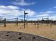 Community playground with monkey bars, climbing structure, and soft surface ground at 5531 W Hopi Trl, Laveen, AZ 85339
