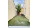 This backyard features artificial grass and a small tree at 7136 N 73Rd Dr, Glendale, AZ 85303