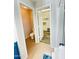 Well-lit bathroom showcasing a toilet room and walk-in closet with ample shelving at 7136 N 73Rd Dr, Glendale, AZ 85303