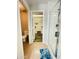 Bathroom view showing a toilet room and walk-in closet with ample shelving and glass shower at 7136 N 73Rd Dr, Glendale, AZ 85303