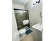 Modern bathroom featuring a glass-enclosed shower, toilet, and contemporary sink with gray vanity at 7136 N 73Rd Dr, Glendale, AZ 85303