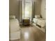 Bright bedroom with two beds, a central nightstand, and natural light filtering through the window at 7136 N 73Rd Dr, Glendale, AZ 85303