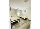 Inviting bedroom with twin beds, light-colored walls, and stylish, wood-look flooring at 7136 N 73Rd Dr, Glendale, AZ 85303