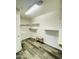Spacious walk-in closet with ample shelving and a built-in bench for convenience at 7136 N 73Rd Dr, Glendale, AZ 85303