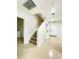 Staircase leading to the upper level, with access to the laundry room and front door at 7136 N 73Rd Dr, Glendale, AZ 85303