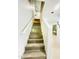 Interior staircase with wooden steps and white railing, leading to the upper floor at 7136 N 73Rd Dr, Glendale, AZ 85303