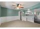 Spacious bedroom with chair railing, ceiling fan, and built-in desk provides a comfortable and functional living space at 8020 E Keats Ave # 285, Mesa, AZ 85209