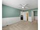 Relaxing bedroom with white trim, ceiling fan, and access to the kitchen and bathroom at 8020 E Keats Ave # 285, Mesa, AZ 85209