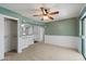 Spacious bedroom with chair railing, ceiling fan, and closet provides a comfortable and functional living space at 8020 E Keats Ave # 285, Mesa, AZ 85209