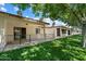 Exterior facade of the building featuring a patio and grassy area at 8020 E Keats Ave # 285, Mesa, AZ 85209