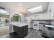 Modern kitchen featuring sleek black countertops, white cabinets, stainless steel appliances, and stylish backsplash at 8020 E Keats Ave # 285, Mesa, AZ 85209