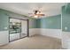 Inviting living room with a ceiling fan and sliding door to the outdoor patio at 8020 E Keats Ave # 285, Mesa, AZ 85209