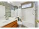 Full bathroom featuring a shower over tub, vanity and decorative wallpaper at 8046 W Yukon Dr, Peoria, AZ 85382