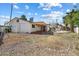 Backyard with a covered patio, mature trees, and plenty of space for outdoor activities at 946 S Pomeroy Cir, Mesa, AZ 85210