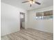 Bedroom with new vinyl floors, a window, and an ensuite bathroom at 946 S Pomeroy Cir, Mesa, AZ 85210