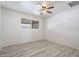 Bright bedroom features new vinyl floors, large window, and ceiling fan at 946 S Pomeroy Cir, Mesa, AZ 85210