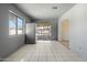 Open dining area with tile flooring leading to a backyard patio, perfect for indoor-outdoor living at 946 S Pomeroy Cir, Mesa, AZ 85210