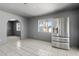 Bright dining room featuring tile floors and natural light, creating an inviting space for Gathering meals and entertaining at 946 S Pomeroy Cir, Mesa, AZ 85210