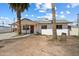 Charming single-story home featuring palm trees and a well-maintained yard in a quiet neighborhood at 946 S Pomeroy Cir, Mesa, AZ 85210