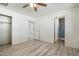 Main bedroom with new vinyl floors, walk in closet, and a bathroom entrance at 946 S Pomeroy Cir, Mesa, AZ 85210