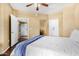 Comfortable bedroom with neutral tones, ensuite and large doorways to other rooms at 10030 W Indian School Rd # 221, Phoenix, AZ 85037