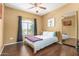 Bedroom featuring a bed, a large mirror and a window for natural light at 10030 W Indian School Rd # 221, Phoenix, AZ 85037