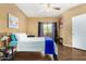 Comfortable bedroom with a sliding door to the outside and a ceiling fan at 10030 W Indian School Rd # 221, Phoenix, AZ 85037