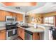 Well-equipped kitchen featuring stainless steel appliances with open layout to the living area at 10030 W Indian School Rd # 221, Phoenix, AZ 85037