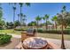 Community outdoor kitchen area with a barbecue grill and picnic table for resident use at 10030 W Indian School Rd # 221, Phoenix, AZ 85037