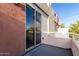 Private balcony with sliding glass door access and balcony railing at 1056 N Miller Rd, Tempe, AZ 85288
