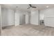 Spacious bedroom featuring neutral carpet, a ceiling fan, and easy access to closet and bathroom at 1056 N Miller Rd, Tempe, AZ 85288