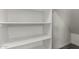 The white-shelved closet has ample space for storage and a clothes hook at 1056 N Miller Rd, Tempe, AZ 85288