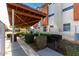 Community outdoor picnic and grill area with picnic tables and grill at 1056 N Miller Rd, Tempe, AZ 85288
