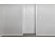 Hallway featuring a white barn door with black hardware and light switch at 1056 N Miller Rd, Tempe, AZ 85288