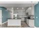 Modern kitchen features stainless steel appliances, gray cabinets, and a sleek island at 1056 N Miller Rd, Tempe, AZ 85288