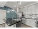 Stylish kitchen island features a stainless steel sink and chrome faucet at 1056 N Miller Rd, Tempe, AZ 85288