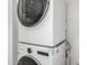 This well-equipped laundry area features a stacked washer and dryer at 1056 N Miller Rd, Tempe, AZ 85288