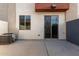 Private outdoor patio with concrete pavers, block wall, and access to sliding glass door at 1056 N Miller Rd, Tempe, AZ 85288