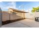 Private outdoor patio with concrete pavers, block wall, and view of utilities at 1056 N Miller Rd, Tempe, AZ 85288