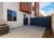 Private outdoor patio with concrete pavers, block wall, and access to sliding glass door at 1056 N Miller Rd, Tempe, AZ 85288