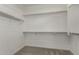 Walk-in closet with ample shelving and storage space, offering an organized solution at 1056 N Miller Rd, Tempe, AZ 85288