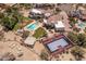 Aerial view of the property showcases the home, pool, spa, and basketball court at 11809 S Montezuma Ct, Phoenix, AZ 85044