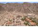 This aerial view captures the property's setting near picturesque mountains and surrounding desert landscape at 11809 S Montezuma Ct, Phoenix, AZ 85044