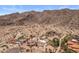 The aerial view captures a desert oasis with a large home, sparkling pools, and mountain views at 11809 S Montezuma Ct, Phoenix, AZ 85044