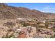 From an elevated perspective, the surrounding homes offer stunning desert views with the mountains on the horizon at 11809 S Montezuma Ct, Phoenix, AZ 85044