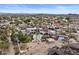 Estate with pool, tennis court, and lush landscaping surrounded by desert and residential areas at 11809 S Montezuma Ct, Phoenix, AZ 85044