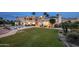 Expansive backyard featuring a large pool, patios, and a lush lawn area at 11809 S Montezuma Ct, Phoenix, AZ 85044