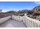 Stunning mountain views from this rooftop balcony with white railing and tiled roof at 11809 S Montezuma Ct, Phoenix, AZ 85044